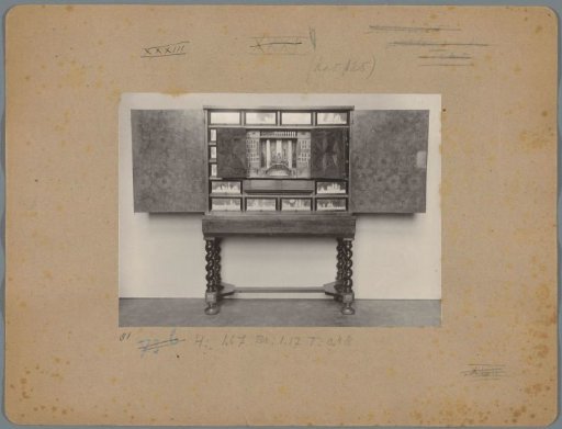 Cabinet on turned legs with ship motifs on the drawers and a miniature vestibule behind the doors
