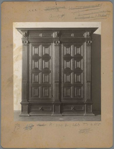 Cabinet ornamented with columns and heads
