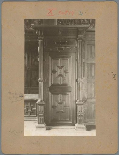 Part of wall paneling with a door