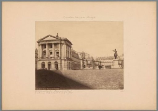 View of the Palace of Versailles with a small group of people in front