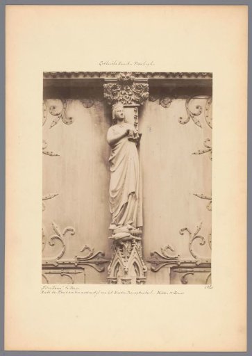 Sculpture of Mary at the portal of Notre-Dame in Paris