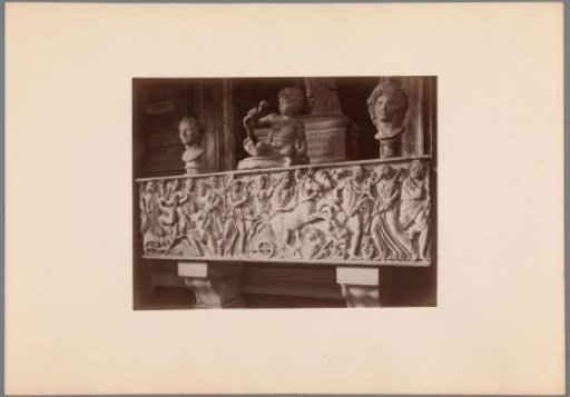 Arrangement of a relief, two busts, and a statue of Heracles with snakes (possibly) in the Capitoline Museums