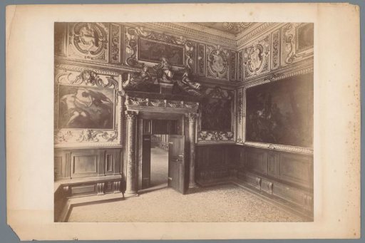 Interior of a waiting room, decorated with paintings and reliefs