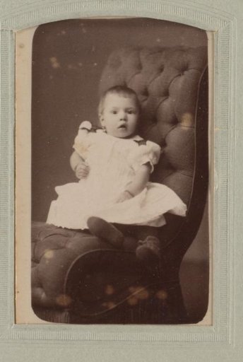 Portrait of a toddler on a chair