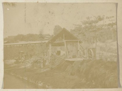 Factory with a machine, located by the river