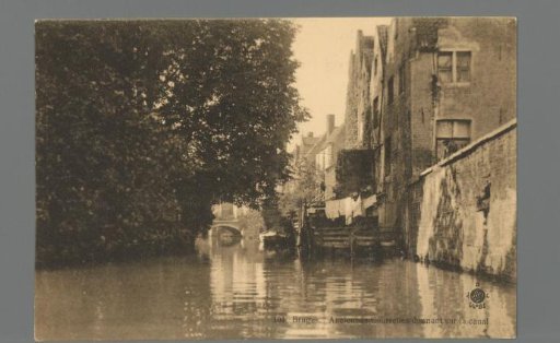 Bruges. Old courtyards overlooking the canal