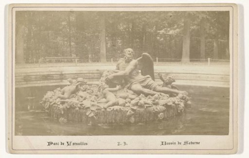 Statue of Saturn in a fountain in the gardens of Versailles