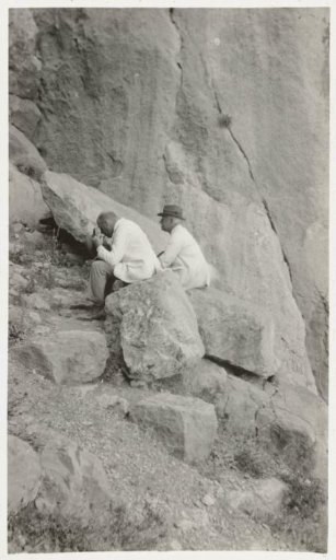The gentlemen Bierens de Haan sitting under a steep rock