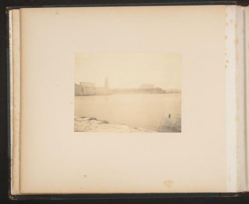 Coast with a Lighthouse and Other Buildings