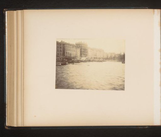 Moored ships and buildings seen from the water