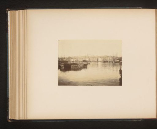 View of ships and a city from the water