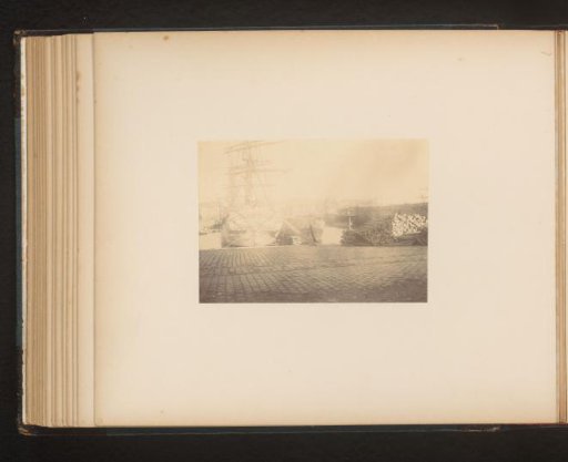 Moored ship and a cargo of logs
