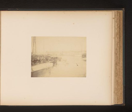 Moored ships and a cargo of logs