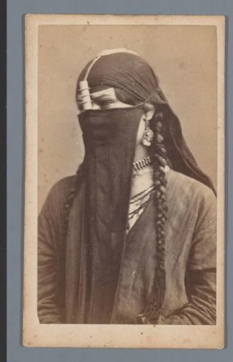 Portrait of an Arab woman with braids, earrings and necklace
