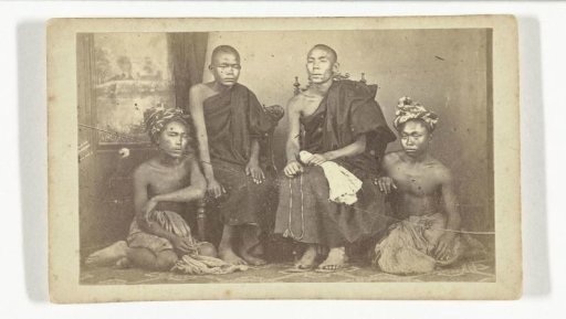Portrait of four Asian men, two of whom are clergymen