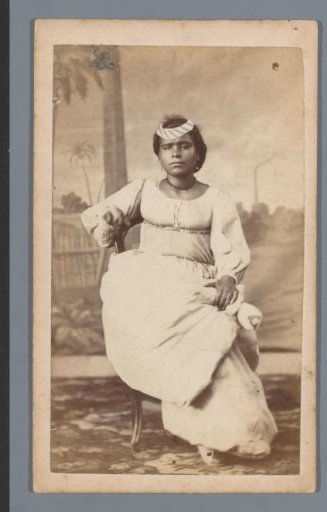 Studio portrait of a woman in a white dress