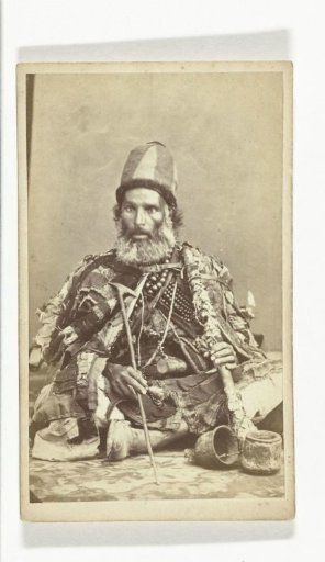 Portrait of a dervish with a pipe