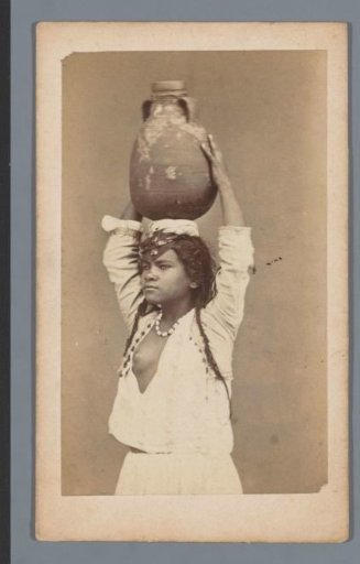 Portrait of a young woman with a water jug on her head