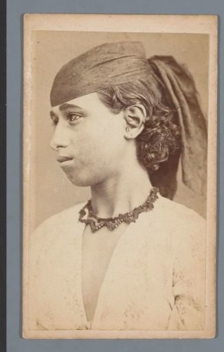 Portrait of a young Arab woman with a cloth tied around her head