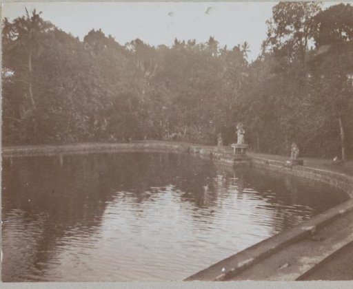 Pond with three statues on the edge, Marmada, Lombok
