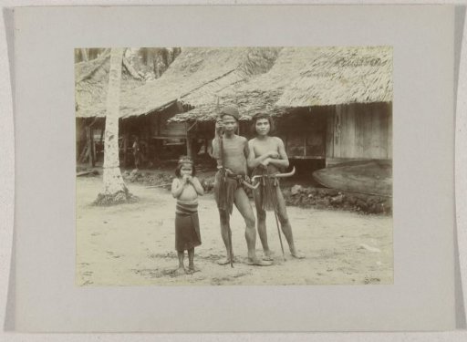 Two men and a child on Nias