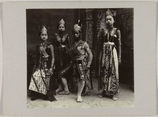 Studio portrait of a boy and three girls in festive attire in the Dutch East Indies