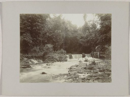 Two men at a waterfall near Soekaboemi