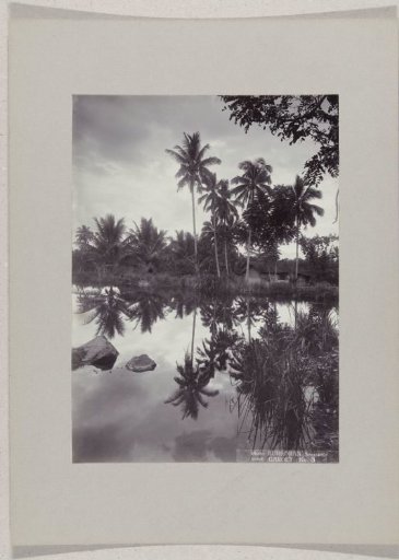 Fish ponds with cottages on the shore at Tjipanas near Garoet, Dutch East Indies