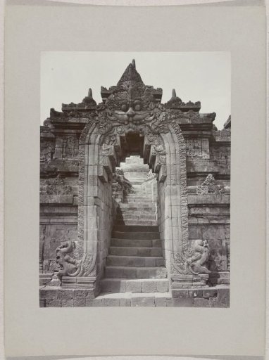 Gate with reliefs of the Borobudur (Boroboedoer), near Magelang, Dutch East Indies
