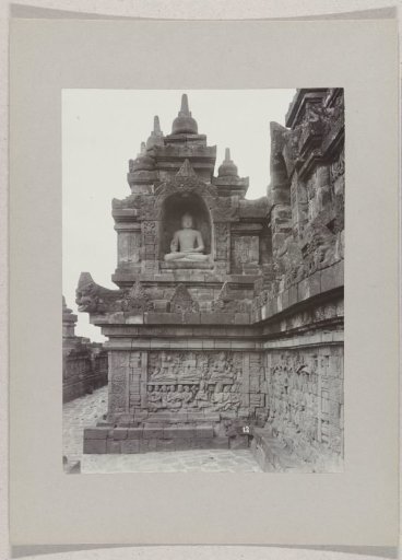 Gallery of the Borobudur (Boroboedoer) with an image of Buddha, near Magelang, Dutch East Indies