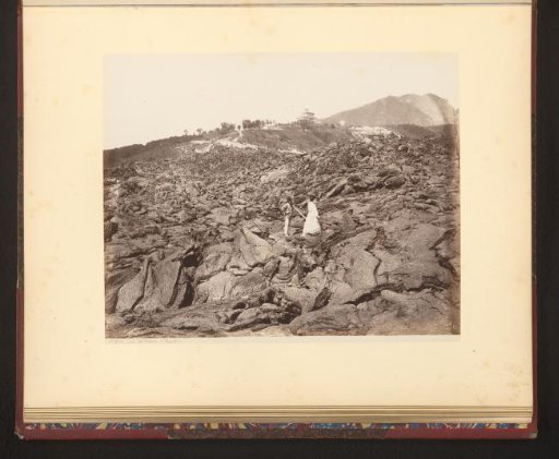 Man and woman on hardened lava after an eruption of Vesuvius