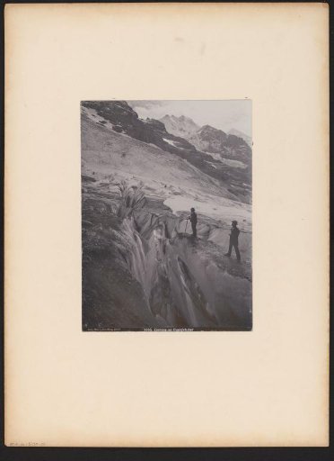 Two Men at a Glacier Crevasse in the Eiger Glacier