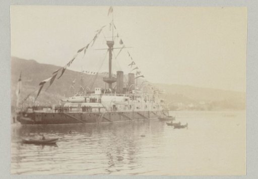 Sailing ship decorated with flags along the masts