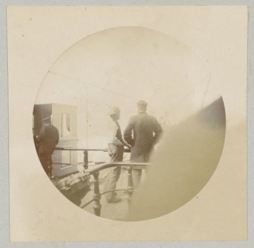 Two men in conversation on board a ship