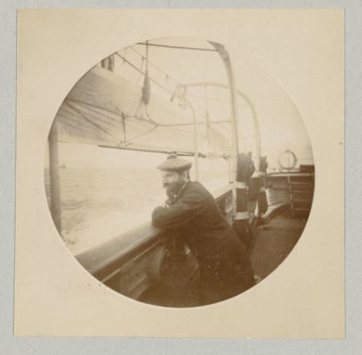Carl Saltzmann, the draftsman and photographer, leaning on the railing of a ship and gazing overboard