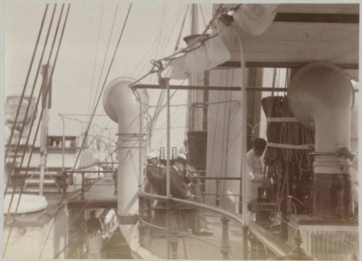 Passengers and crew on the upper deck of a ship in the Norwegian Sea