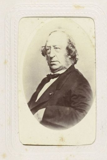 Portrait of a bearded man in a coat with a bow