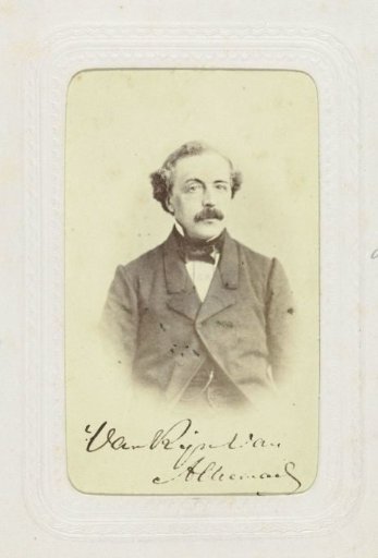 Studio portrait of a man with mustache in a frock coat