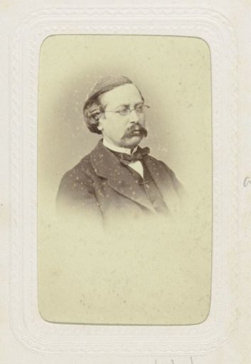 Studio Portrait of a Man with a Mustache and Glasses