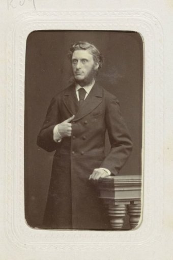 Studio Portrait of a Man with Large Sideburns Extending into a Beard