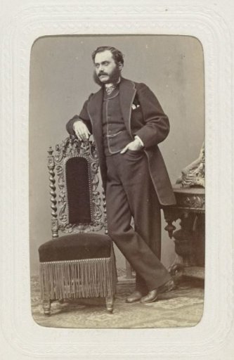 Studio Portrait of a Man with Large Sideburns Extending into a Beard