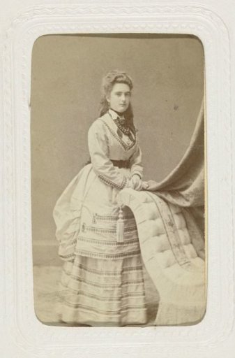Studio Portrait of a Woman by a Chair