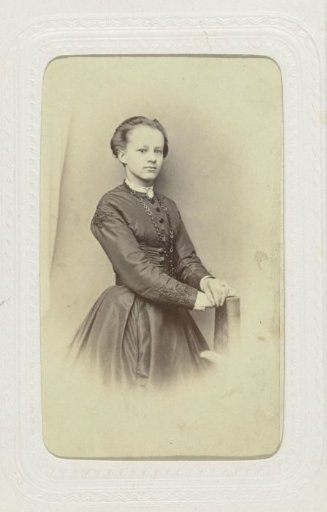 Studio Portrait of a Young Woman in a High-Closed Black Dress