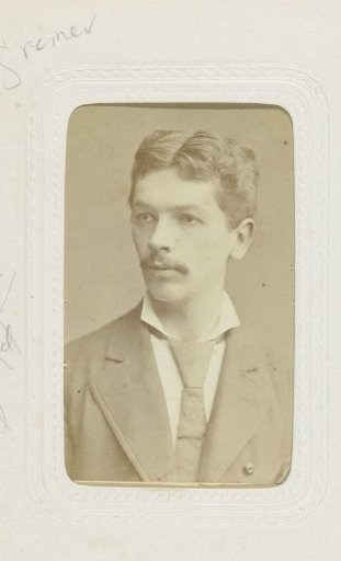 Studio portrait of a man with a mustache and cravat
