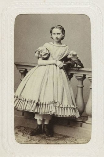 Studio portrait of a girl in a full dress