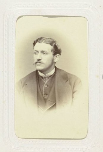 Studio portrait of a man with a mustache and cravat