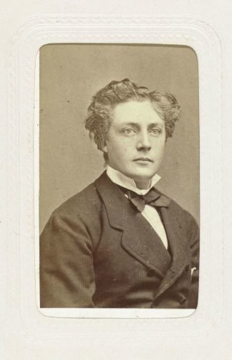 Studio portrait of a young man with curly hair