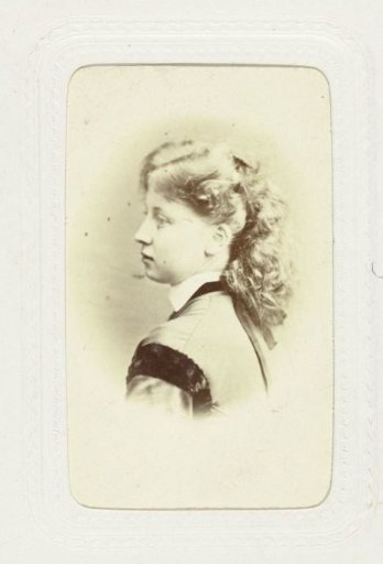 Studio portrait of a young woman with curly hair