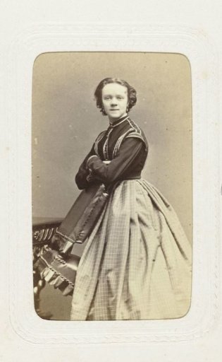 Studio portrait of a young woman in a long full skirt