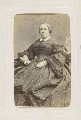 Studio portrait of a woman in a long dress with spots